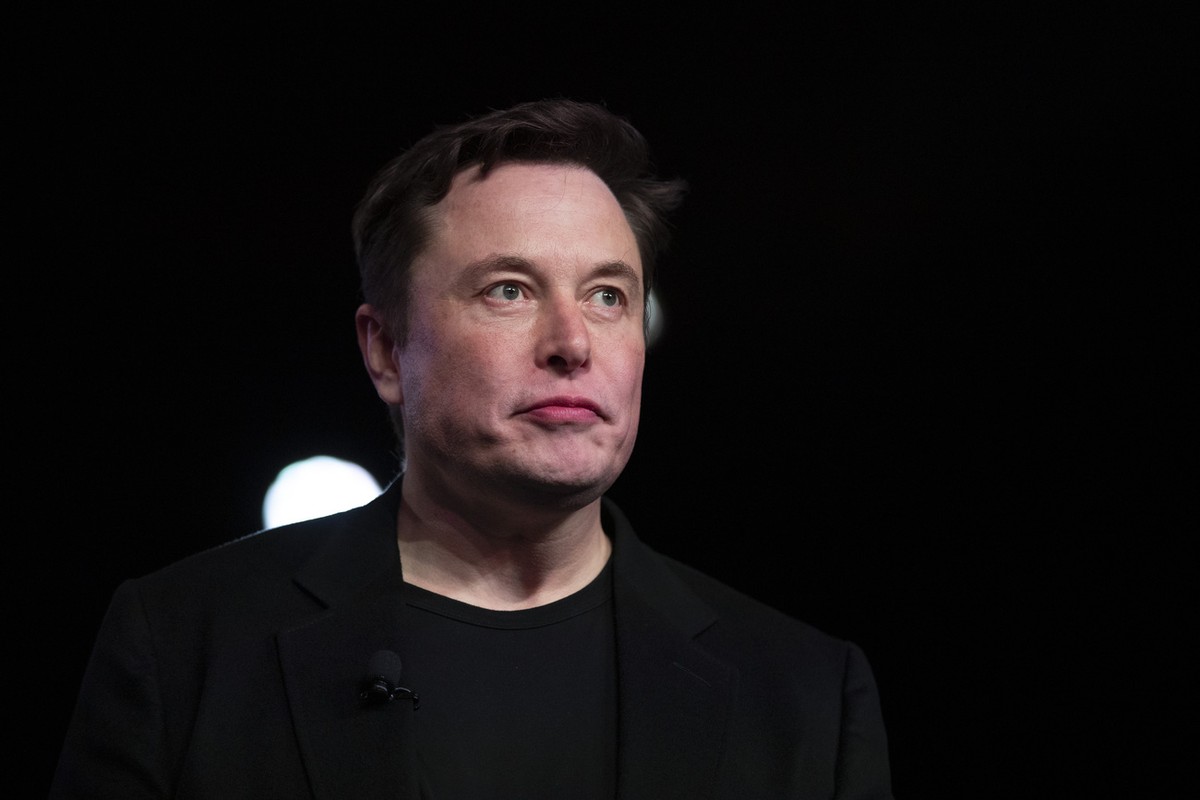 FILE - In this March 14, 2019, file photo Tesla CEO Elon Musk pauses while speaking before unveiling the Model Y at the company's design studio in Hawthorne, Calif. Musk will face the electric ca ...