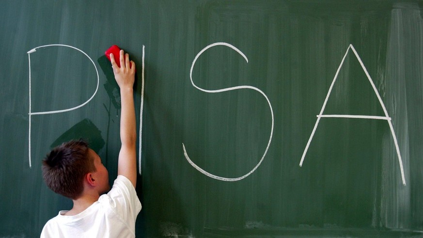 A boy is wiping a blackboard on which the acronym PISA (programme for international student assessment) is written, Magdeburg, July 8, 2003. In former and recent evaluations of the assessment Germany  ...