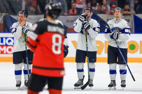 epa11351064 Players of Finland react after the preliminary round group A match between Canada and Finland at the IIHF Ice Hockey World Championship 2024 at Prague Arena, in Prague, Czech Republic, 18  ...