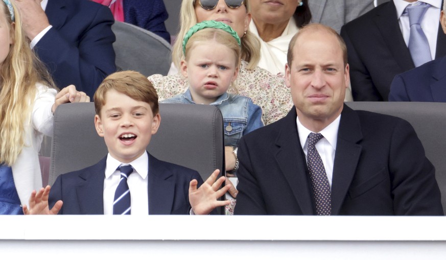 Prince George and Prince William watch the Platinum Jubilee Pageant, in London, Sunday June 5, 2022, on the last of four days of celebrations to mark the Platinum Jubilee. The pageant will be a carniv ...