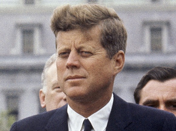 FILE - President John F. Kennedy listens as Grand Duchess Charlotte of Luxembourg speaks outside the White House, April 30, 1963, in Washington.  The 60th anniversary of President Kennedy's ass...