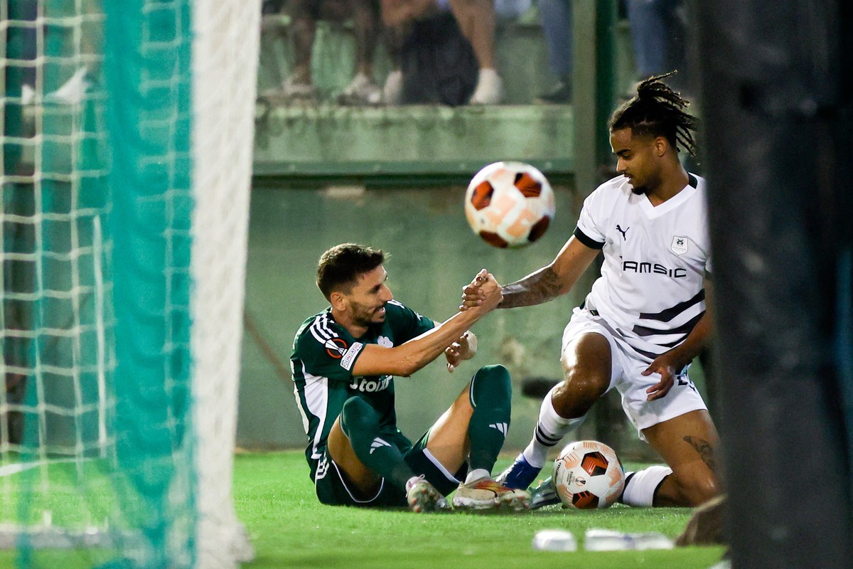epa10941478 Panathinaikos?s Filip Mladenovic (L) and Rennes?s Lorenz Assignon (R) interact during the UEFA Europa League match between Panathinaikos FC and Stade Rennais FC, at Apostolos Nikolaidis st ...