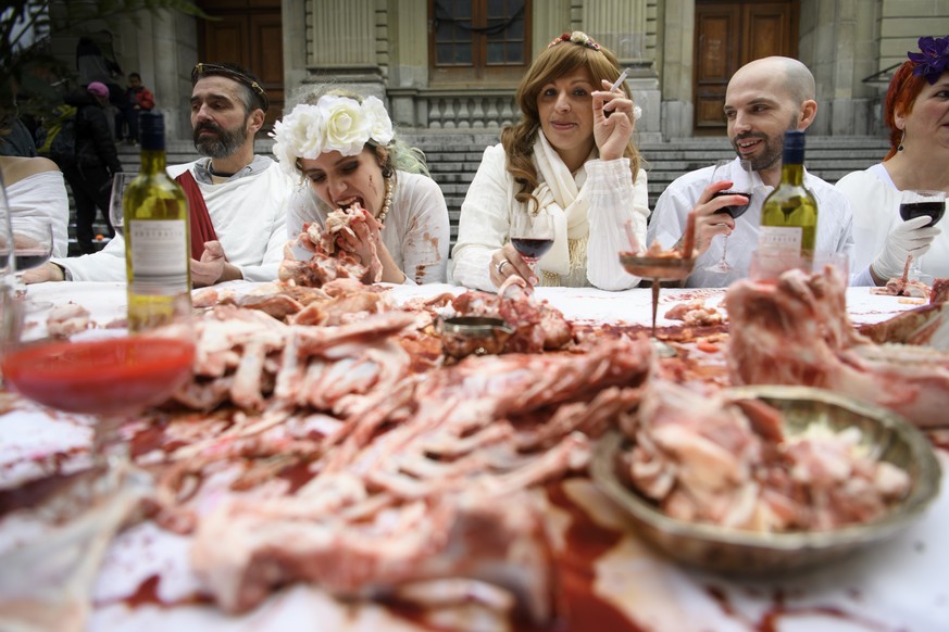 Animal rights activists re-enact the Holy Last Supper during the happening &quot;The Bloody Meal of the Resurrection&quot; at a demonstration by the animal liberation movement &#039;269life&#039;, in  ...