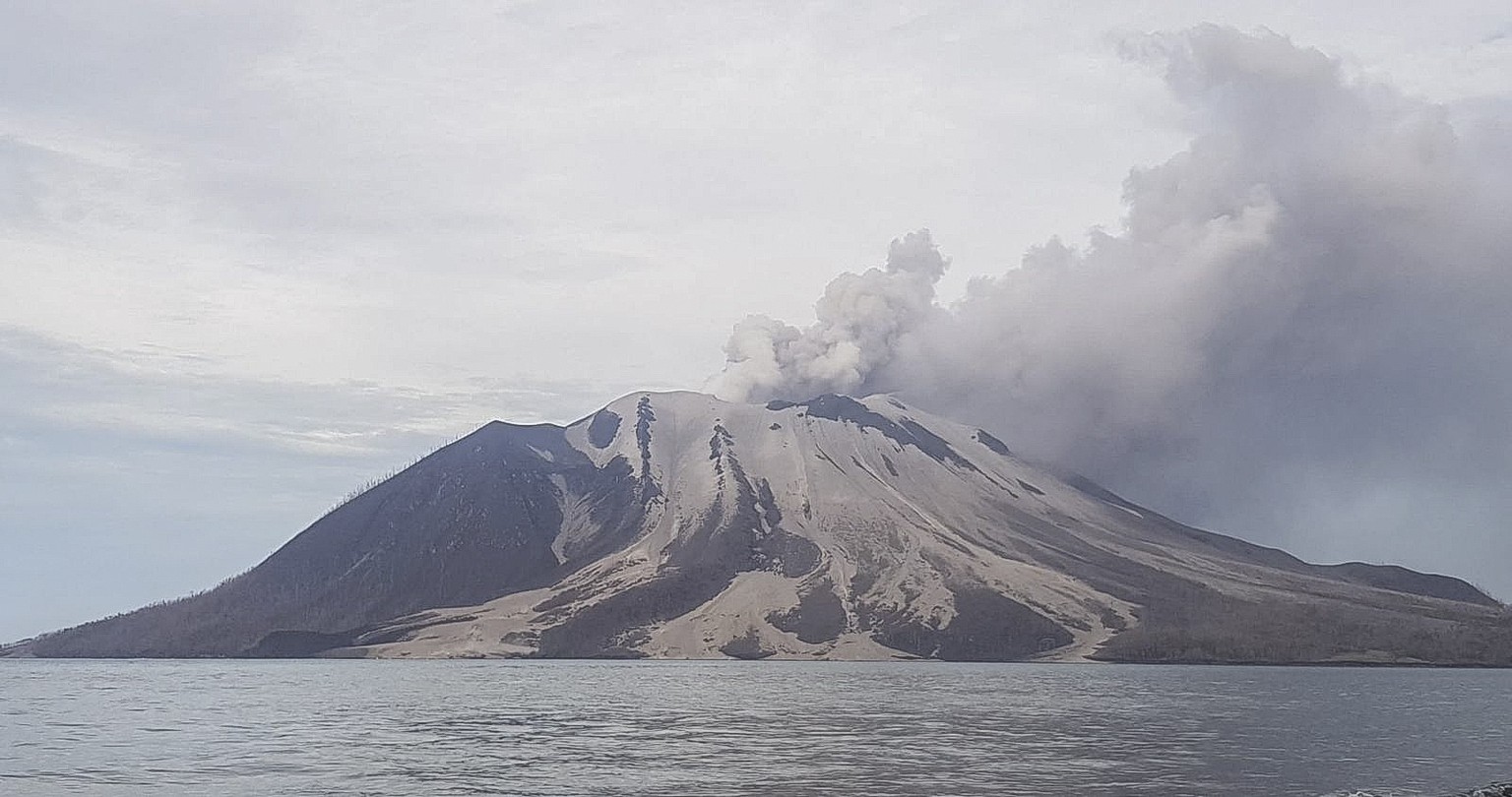 epa11311758 A handout photo made available by the Vulcanology and Geological Disaster Mitigation Center (PVMBG) of the Indonesian Ministry of Energy and Mineral Resources shows Mount Ruang volcano spe ...
