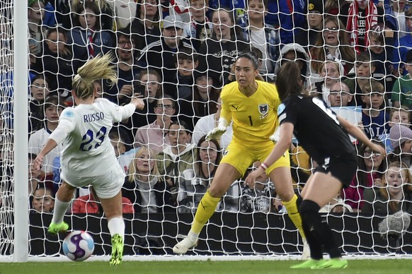 Austria&#039;s goalkeeper Manuela Zinsberger, center, watches as England&#039;s Alessia Russo, left, controls the ball during the Women Euro 2022 soccer match between England and Austria at Old Traffo ...