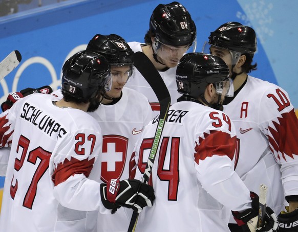 Pius Suter, second from left, of Switzerland, celebrates a goal with his teammates during the second period of the preliminary round of the men&#039;s hockey game against South Korea at the 2018 Winte ...