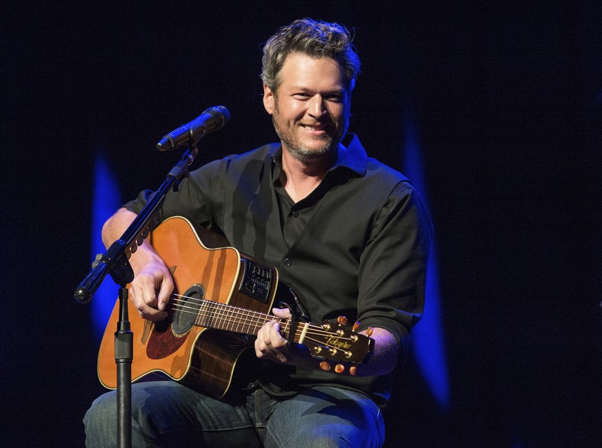 FILE - This June 7, 2016 file photo shows Blake Shelton performing at the 12th Annual Stars for Second Harvest Benefit at Ryman Auditorium in Nashville, Tenn. Shelton was named as People magazine&#039 ...