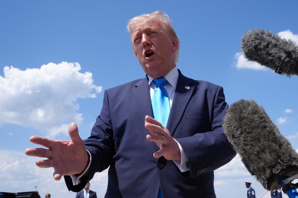 President Donald Trump speaks to the press after returning and stepping off Air Force One, Wednesday, May 20, 2026, at Joint Base Andrews, Md., after speaking at the U.S. Coast Guard Academy commencem ...
