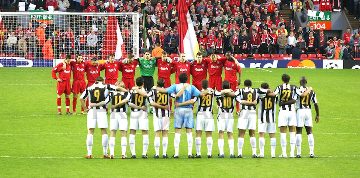 LIVERPOOL, ENGLAND - TUESDAY APRIL 5th 2005: Liverpool and Juventus players stand for a minute's silence to remember the 39 victims of the Heysel Stadium disaster in 1985 before the UEFA Champion ...