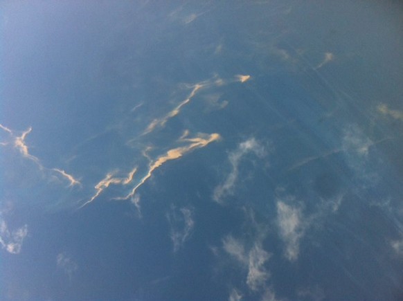 epa04115540 A handout picture provided by Tienphong.vn shows what is believed to be an oil slick stretching a length of about 15-20 km in the sea off the Vietnamese coast, 08 March 2014. The slick is  ...