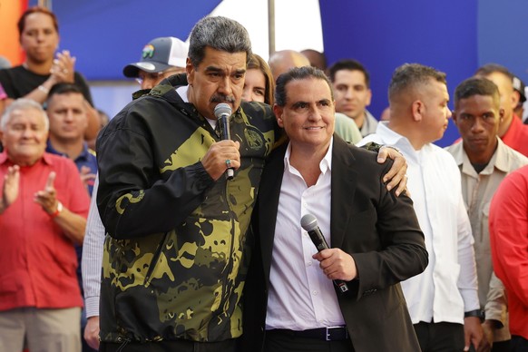 FILE - Venezuela's President Nicolas Maduro, left, and Alex Saab stand together during an event marking the anniversary of the 1958 coup that overthrew dictator Marcos Perez Jimenez, in Caracas,  ...