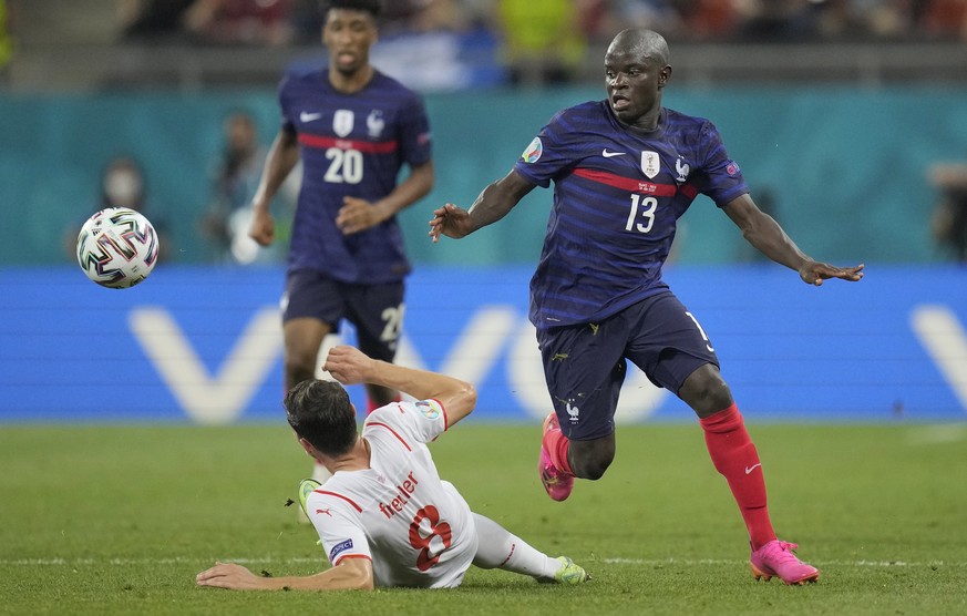 epa09309623 N&#039;Golo Kante of France in action against Remo Freuler (L) of Switzerland during the UEFA EURO 2020 round of 16 soccer match between France and Switzerland in Bucharest, Romania, 28 Ju ...