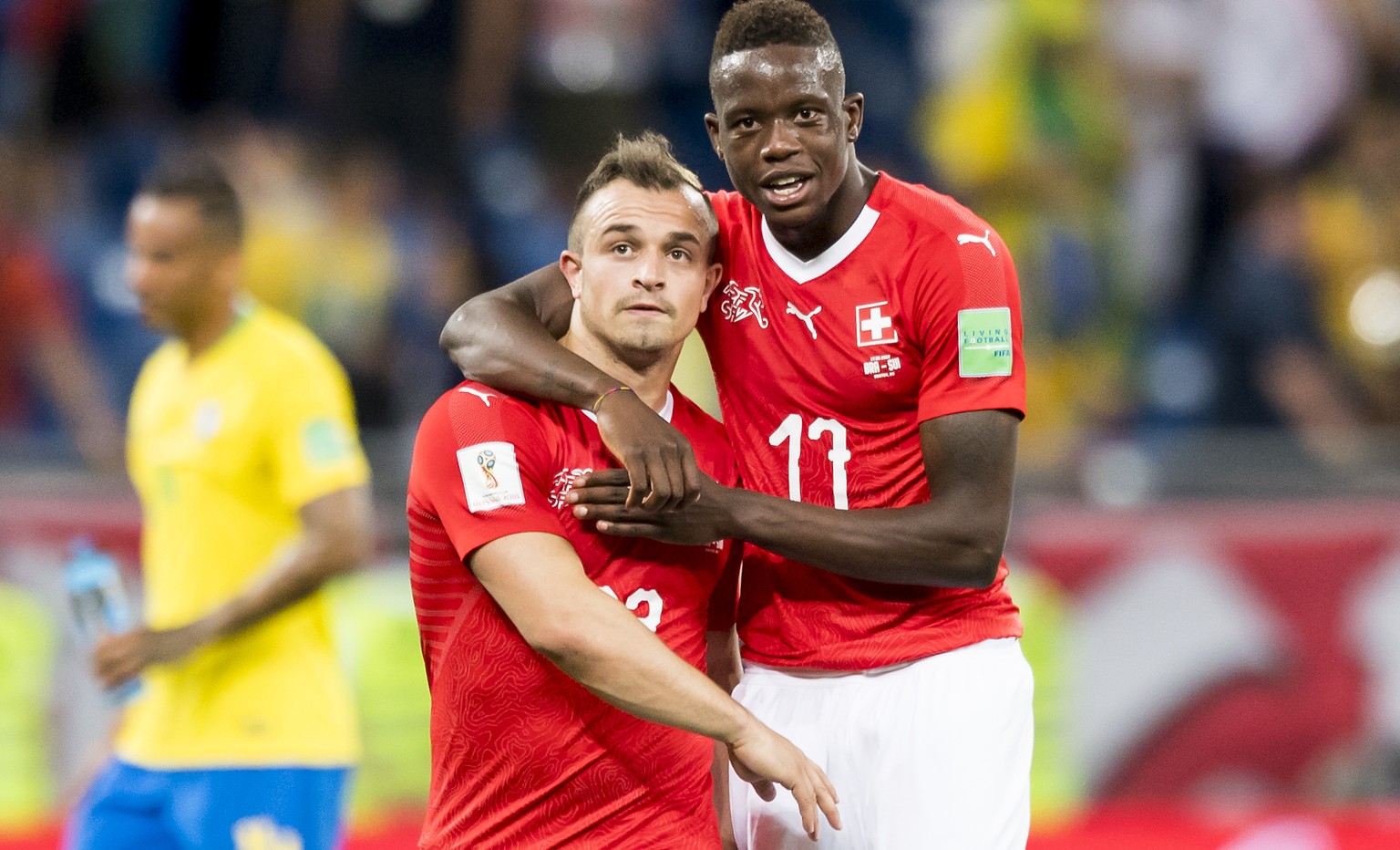 Switzerland&#039;s midfielder Xherdan Shaqiri, left, and Switzerland&#039;s midfielder Denis Zakaria, right, react during the FIFA soccer World Cup 2018 group E match between Switzerland and Brazil at ...