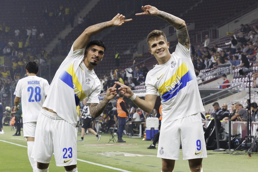 Union Saint-Gilloise&#039;s scorer Dennis Eckert, right, and his teammate Cameron Puertas, left, celebrate the opening goal during the Europa League play-off second leg soccer match between Switzerlan ...