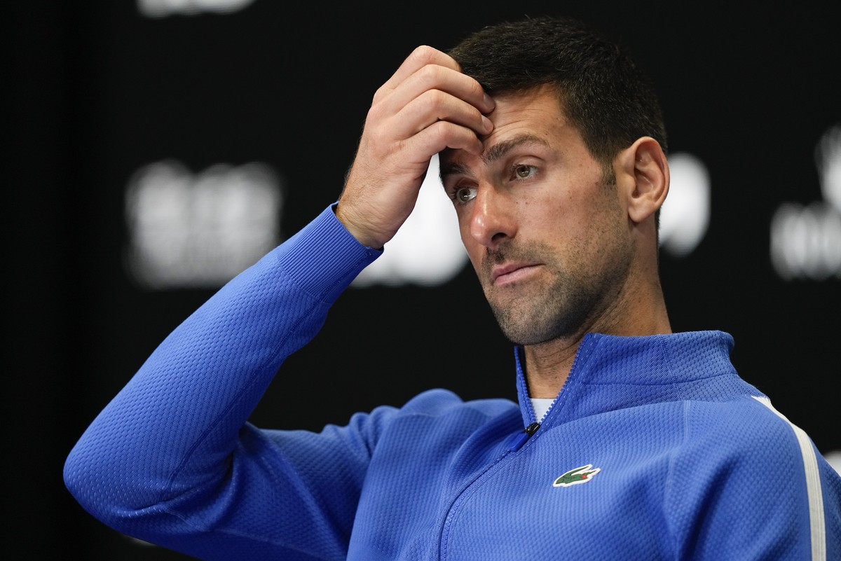 Novak Djokovic of Serbia reacts during a press conference following his loss to Jannik Sinner of Italy in their semifinal at the Australian Open tennis championships at Melbourne Park, Melbourne, Aust ...