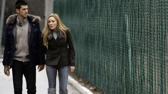 FILE - In this Feb. 6, 2013 file photo Serbia&#039;s tennis player Novak Djokovic, left, and his girlfriend Jelena Ristic arrive for a visit to a school for mentally challenged children in Belgrade, S ...