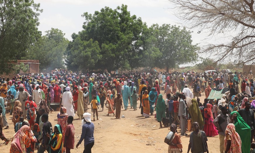 On 17 June 2023, Sudanese refugees cluster in and around Adre’s secondary school. They have fled Western Darfur, most of them the city of El Geneina, because of the violent conflict. Thousands of refu ...