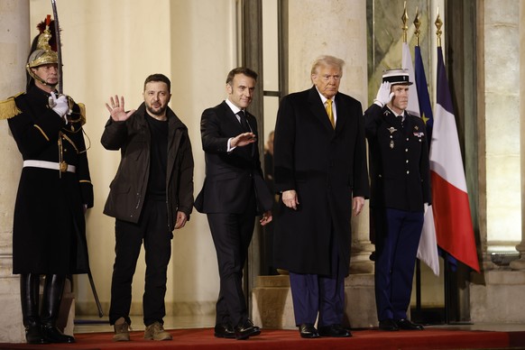 epa11762658 French President Emmanuel Macron (C), US president-elect Donald J. Trump (R) and Ukrainian President Volodymyr Zelensky (L) leave Elysee Palace to attend the reopening ceremony of the Notr ...
