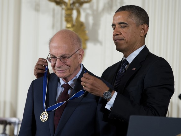 FILE - President Barack Obama awards psychologist Daniel Kahneman with the Presidential Medal of Freedom, Nov. 20, 2013, during a ceremony in the East Room of the White House in Washington. Kahneman,  ...