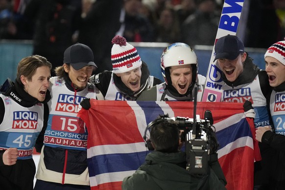 Norway&#039;s team members celebrate after Halvor Egner Granerud, third from right, won the fourth stage of 71th Four Hills ski jumping tournament in Bischofshofen, Austria, Friday, Jan. 6, 2023. (AP  ...