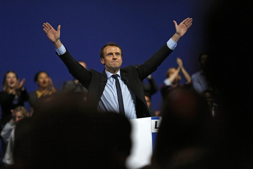 epa05717392 Former French Economy Minister Emmanuel Macron gestures after delivering his speech during a political campaign rally in the Zenith in Lille, France, 14 january 2017. Macron runs as an ind ...