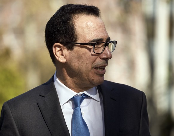 Former Treasury Secretary Steven Mnuchin leaves Brooklyn Federal Court after testifying in Tom Barrack&#039;s trial, Thursday, Oct. 20, 2022, in the Brooklyn borough of New York. Barrack, the onetime  ...