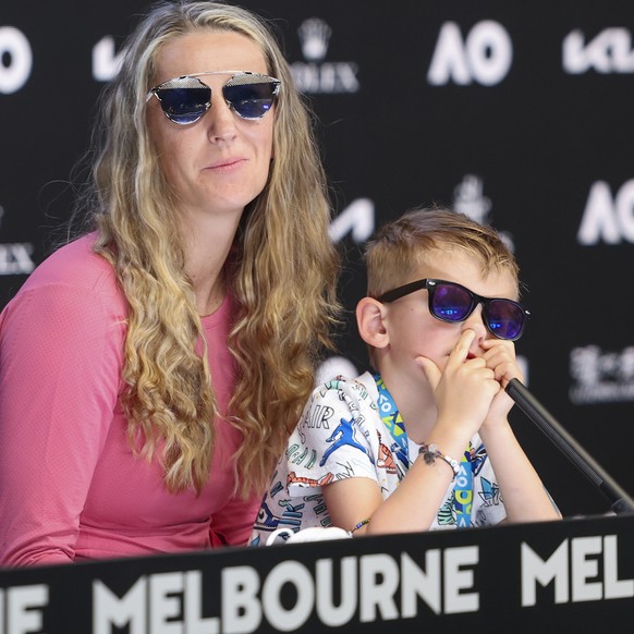 In this photo provided by Tennis Australia, Victoria Azarenka of Belarus sits with her son Leo during a press conference following her third round win over Elina Svitolina of Ukraine at the Australian Open tennis championship in Melbourne, Australia, Friday, Jan. 21, 2022. (David Mariuz/Tennis Australia via AP)