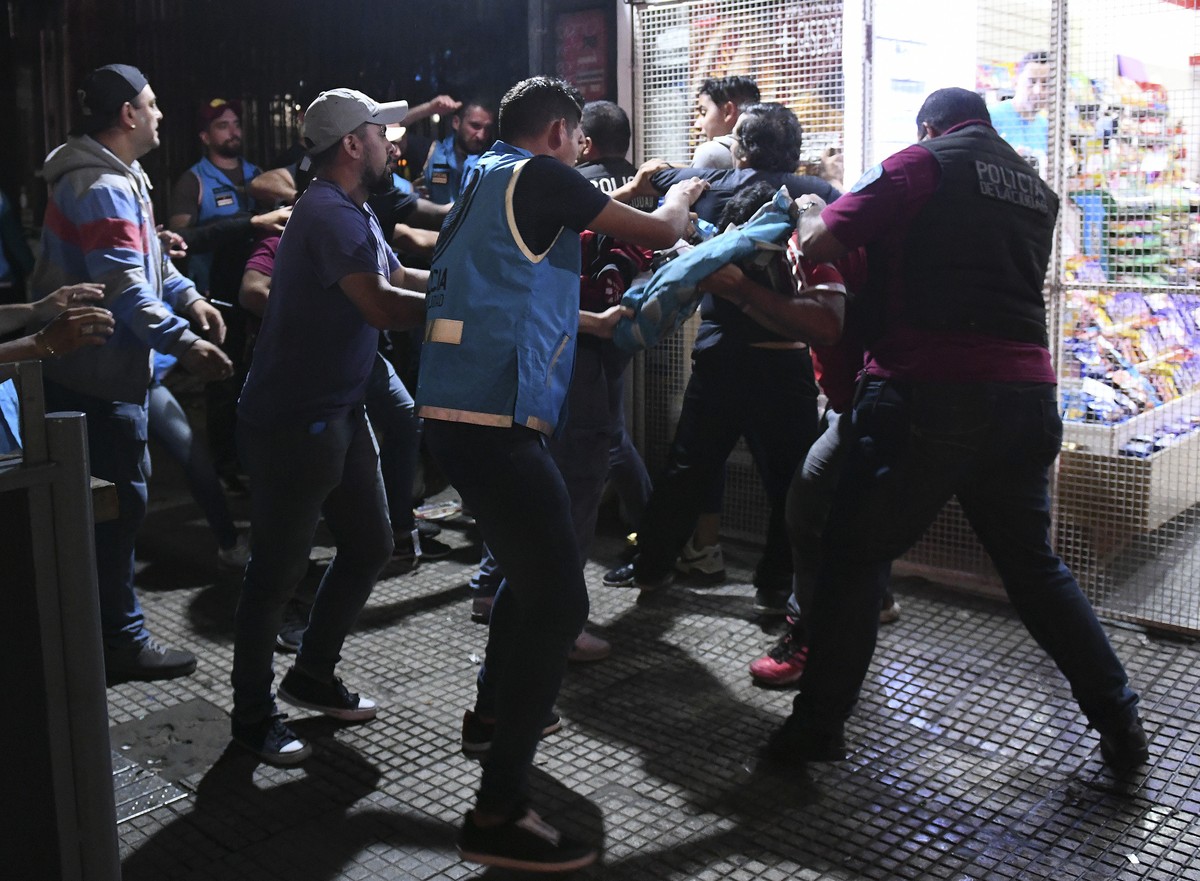 Police make arrests after River Plate soccer fans celebrate the team's 3-1 victory over Boca Juniors, as River clinched the Copa Libertadores championship title with the win, at the Obelisk in Bu ...