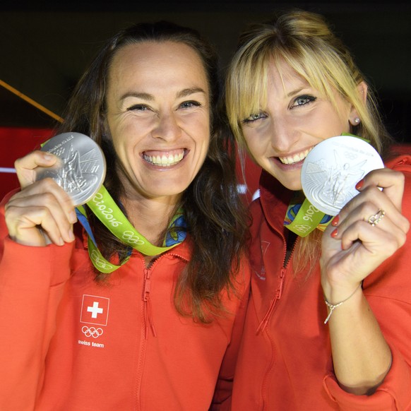 Timea Bacsinszky, right, and Martina Hingis, left, pose with their silver medal in the women’s Tennis Doubles tournament during a medal celebration celebrating in the House of Switzerland at the Rio 2 ...