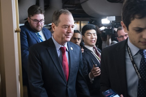 epa08127463 Democratic Representative from California Adam Schiff (L) arrives to attend a Democratic caucus meeting on Capitol Hill in Washington, DC, USA, 14 January 2020. The Senate impeachment tria ...