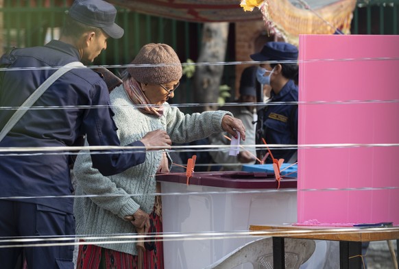epa12796099 A Nepalese woman casts her vote during the parliamentary elections in Kathmandu, Nepal, 05 March 2026. Nepal is holding its first elections since anti-government protests led to the collap ...