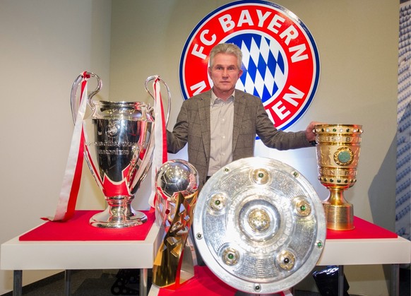epa03730332 Head coach of Bundesliga soccer club Bayern Munich, Jupp Heynckes, poses with the trophies he and his team have won in the season 2012/2013 (L-R: Champions League trophy, DFL Supercup trop ...