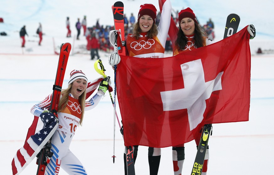 Silver medal winner Mikaela Shiffrin, left, of the United States, poses with gold medal winner Michelle Gisin, center, of Switzerland, and bronze medalist Wendy Holdener, also of Switzerland, during t ...