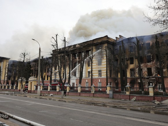 Firefighters hose down the burning building of the Central Research Institute of the Aerospace Defense Forces in the Russian city of Tver, Russia, Thursday, April 21, 2022. The press service of the lo ...