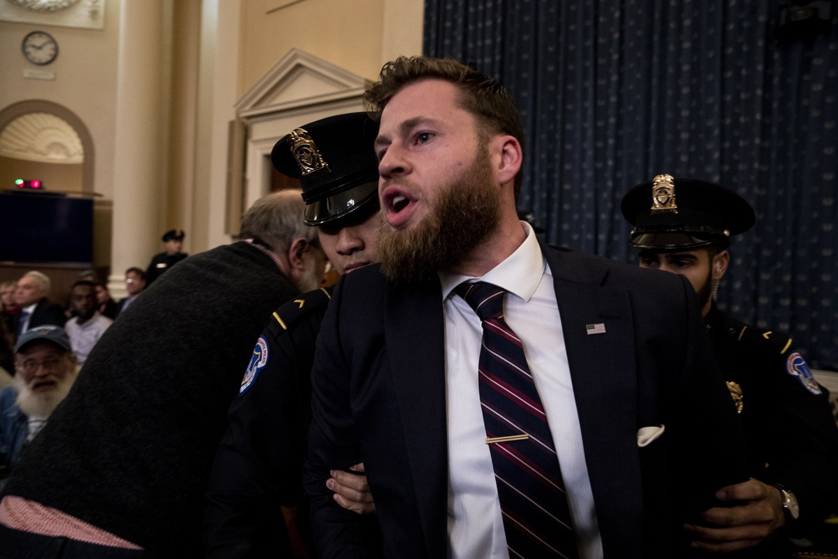epa08057832 A protester is removed during the House Judiciary Committee hearing 'Counsel Presentations of Evidence in the Impeachment Inquiry of President Donald Trump' on Capitol Hill in Wa ...