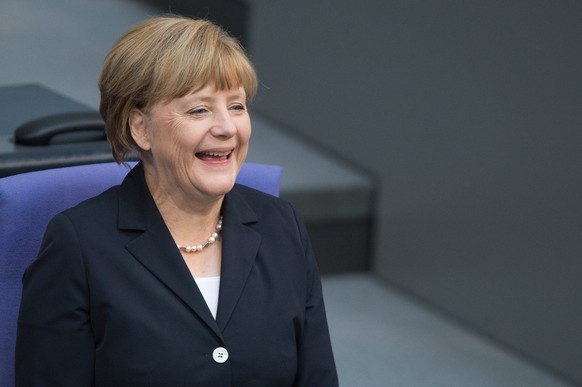 epa04296473 German Chancellor Angela Merkel sits in the German Bundestag in Berlin, Germany, 03 July 2014. The Bundestag is debating the minimun wage. EPA/MAURIZIO GAMBARINI