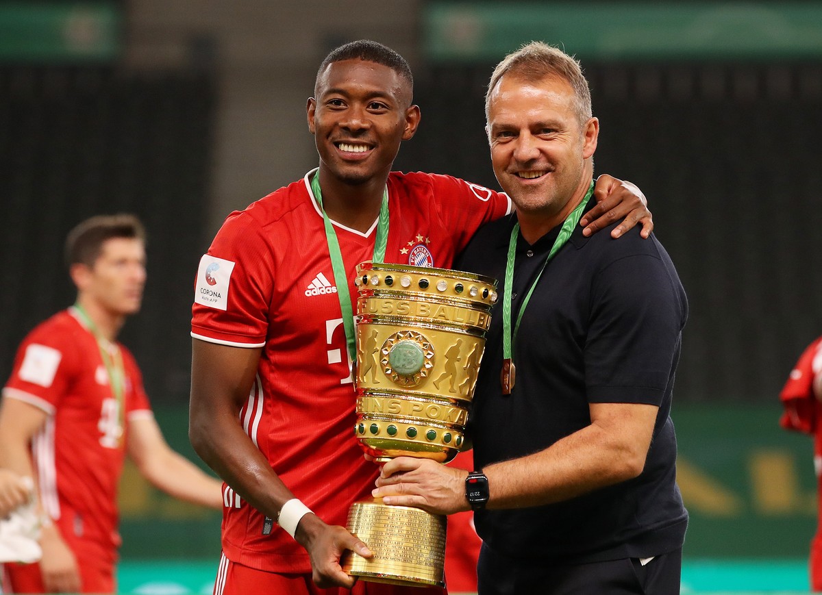 epa08527813 Bayern Munich's head coach Hansi Flick (R) and David Alaba (L) pose with the trophy after winning the German DFB Cup final between Bayer 04 Leverkusen and FC Bayern Munich at Olympic  ...