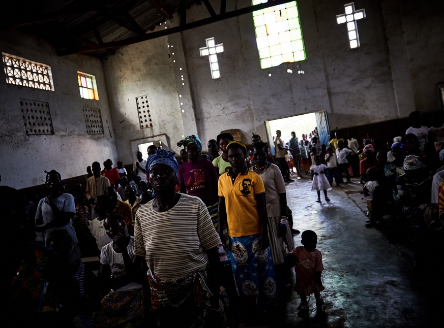 epa08891342 (33/39) Refugees who have fled climate change and conflict factors in South Sudan attend a church service in Biringi refugee settlement, Aru Territory, Ituri Province, Democratic Republic  ...