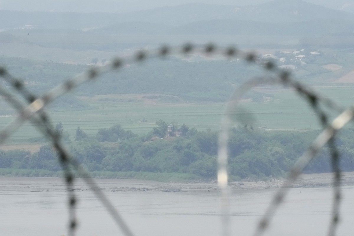North Korea's military guard post is seen through the wire fences in Paju, South Korea, Friday, June 21, 2024. On Friday, South Korea?s military said it had fired warnings shots the previous day  ...