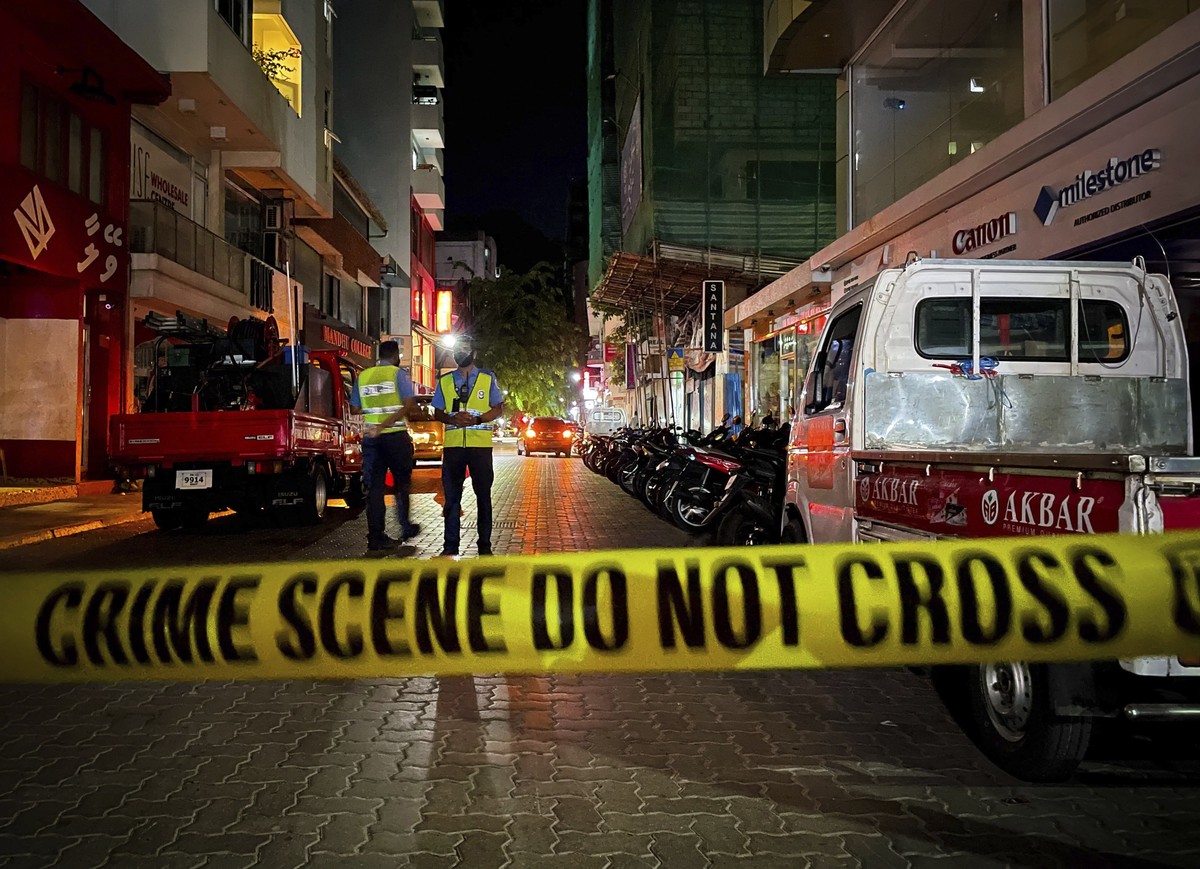 Maldivian police officers secure the area following a blast in Male, Maldives, Thursday, May 6, 2021. Maldives' first democratically elected president and current Parliament Speaker Mohamed Nashe ...