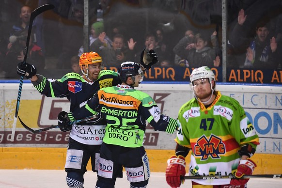 Ambri&#039;s player Matt D&#039;Agostini, left and Ambri&#039;s player Cory Emmerton, right, celebrate 2-0 goal during the preliminary round game of National League Swiss Championship 2017/18 between  ...