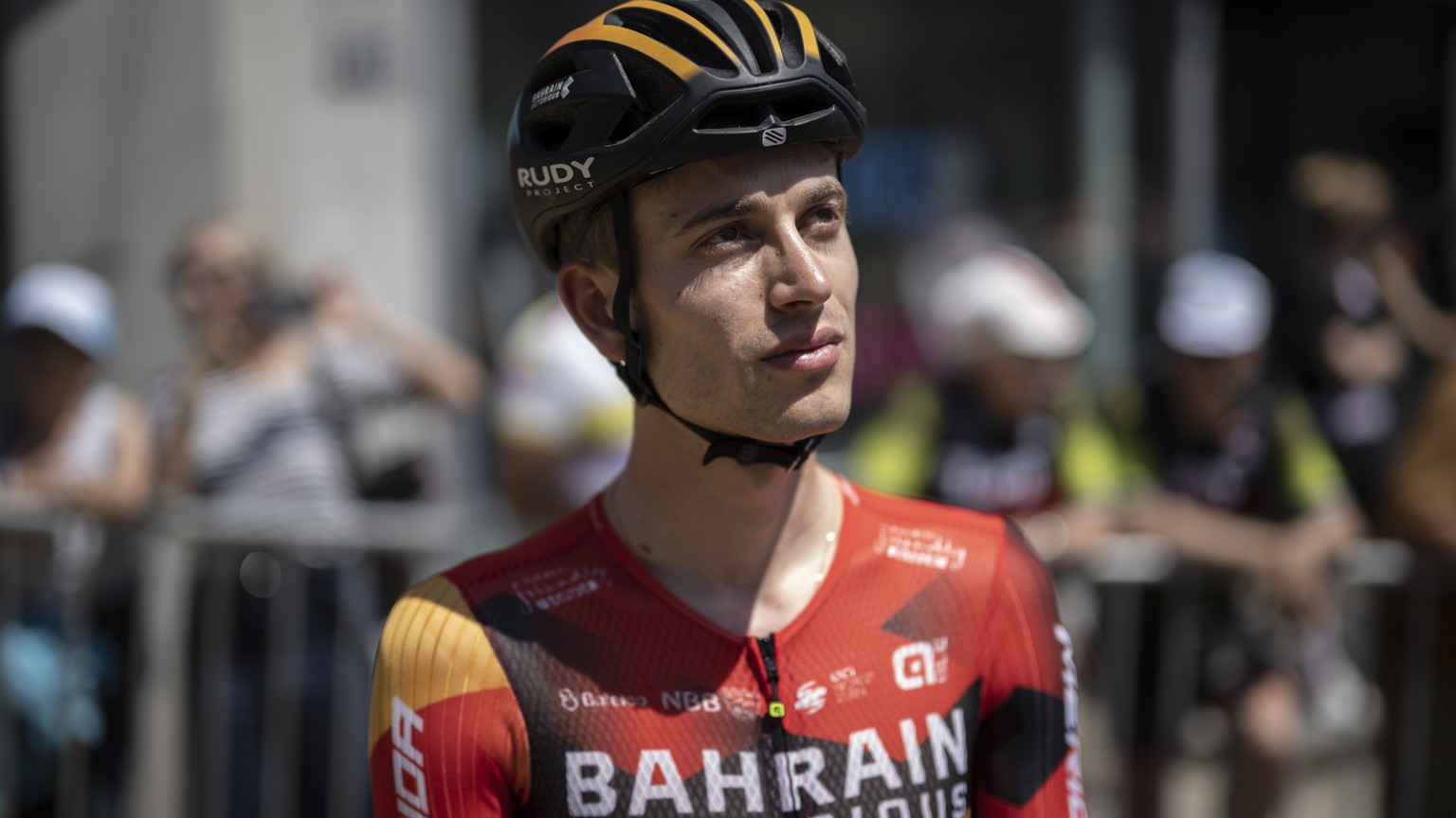 epa10687042 Gino Maeder from Switzerland of Bahrain-Victorious looks on prior the second stage, a 173.7km race from Beromuenster to Nottwil, at the 86th Tour de Suisse UCI World Tour cycling race, 12  ...