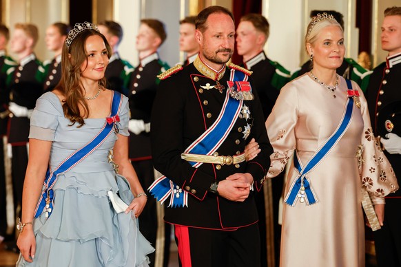 FILE - From left, Norway's Princess Ingrid Alexandra, left, Crown Prince Haakon and Crown Princess Mette-Marit on their way to a gala dinner at the Palace in Oslo, Tuesday, April 8, 2025. (Fredri ...