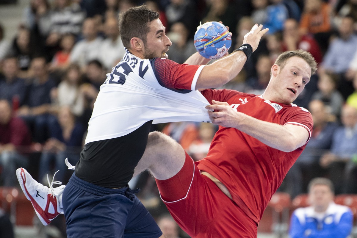 Ukraine's Stanislav Zhukov, left, in action against Switzerland's Lenny Rubin right, during the Yellow Cup Handball game between Switzerland and Ukraine in Switzerland, Winterthur, Friday 03 ...