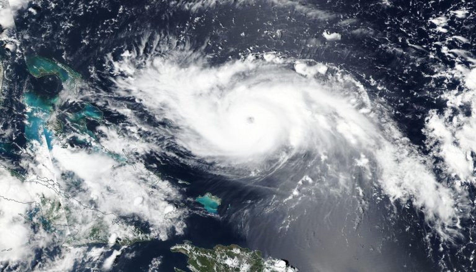 epa07807934 A handout photo made available by NASA showing NOAA-NASA?s Suomi NPP satellite visible light image of Hurricane Dorian on 30 August 2019, issued 31 August 2019 as it was just north of Turk ...