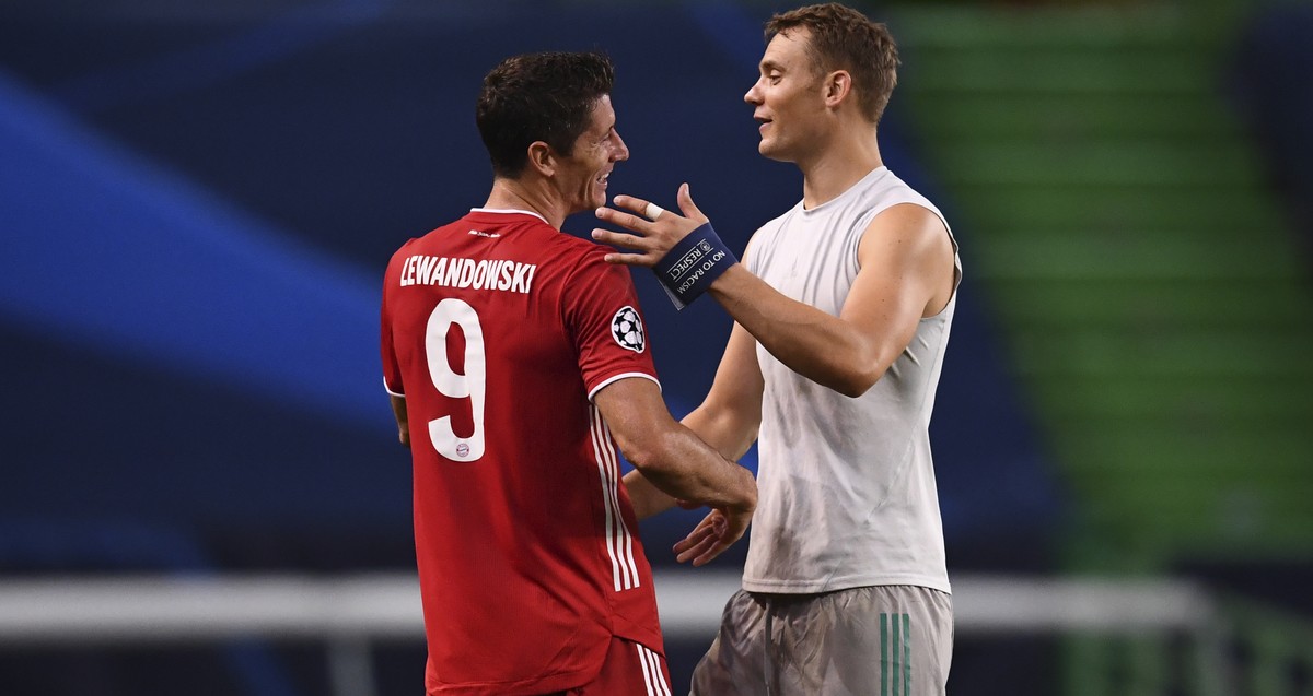 Bayern's Robert Lewandowski, left, and Bayern's goalkeeper Manuel Neuer celebrate at the end of the Champions League semifinal soccer match between Lyon and Bayern at the Jose Alvalade stadi ...