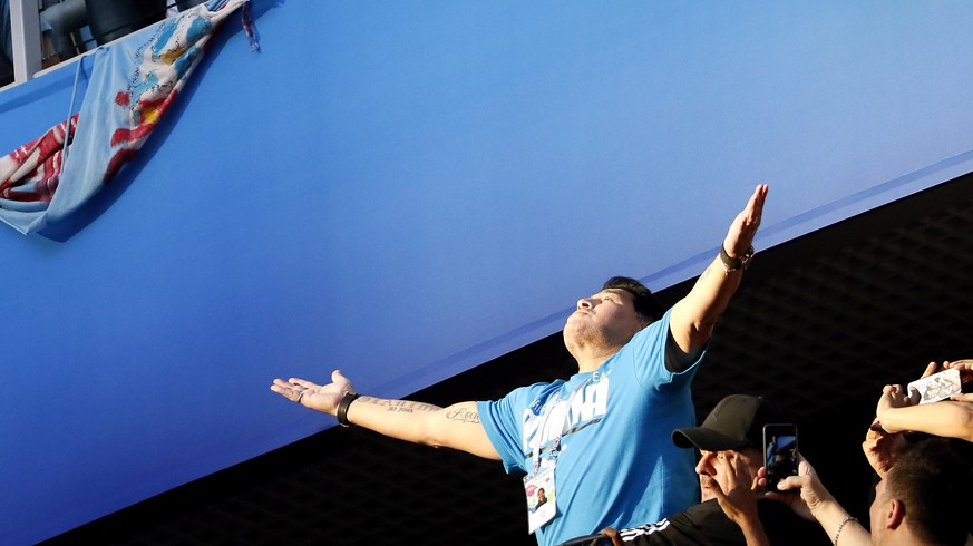 epa06842406 Argentinian soccer legend Diego Maradona reacts prior to the FIFA World Cup 2018 group D preliminary round soccer match between Nigeria and Argentina in St.Petersburg, Russia, 26 June 2018 ...