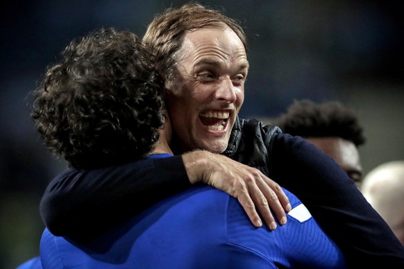 epa09236220 Chelsea's manager Thomas Tuchel (R) celebrates after winning the UEFA Champions League final between Manchester City and Chelsea FC in Porto, Portugal, 29 May 2021. EPA/Manu Fernandez ...