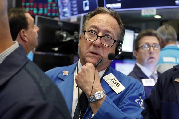 Trader Steven Kaplan works on the floor of the New York Stock Exchange, Monday, Aug. 12, 2019. Stocks are edging lower in early trading on Wall Street amid investor concerns that the U.S.-China trade  ...