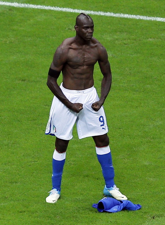 FILE- In this June 28, 2012 file photo, Italy&#039;s Mario Balotelli celebrates scoring his side&#039;s second goal during the Euro 2012 soccer championship semifinal match between Germany and Italy i ...
